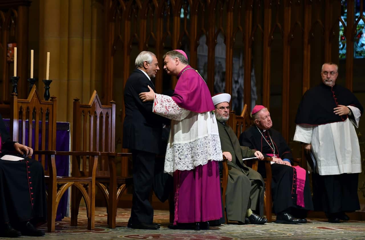 The Grand Mufti of Australia speaks with Archbishop of Sydney Anthony Fisher after he addressed an Interfaith gathering for victims of the Christchurch attack.