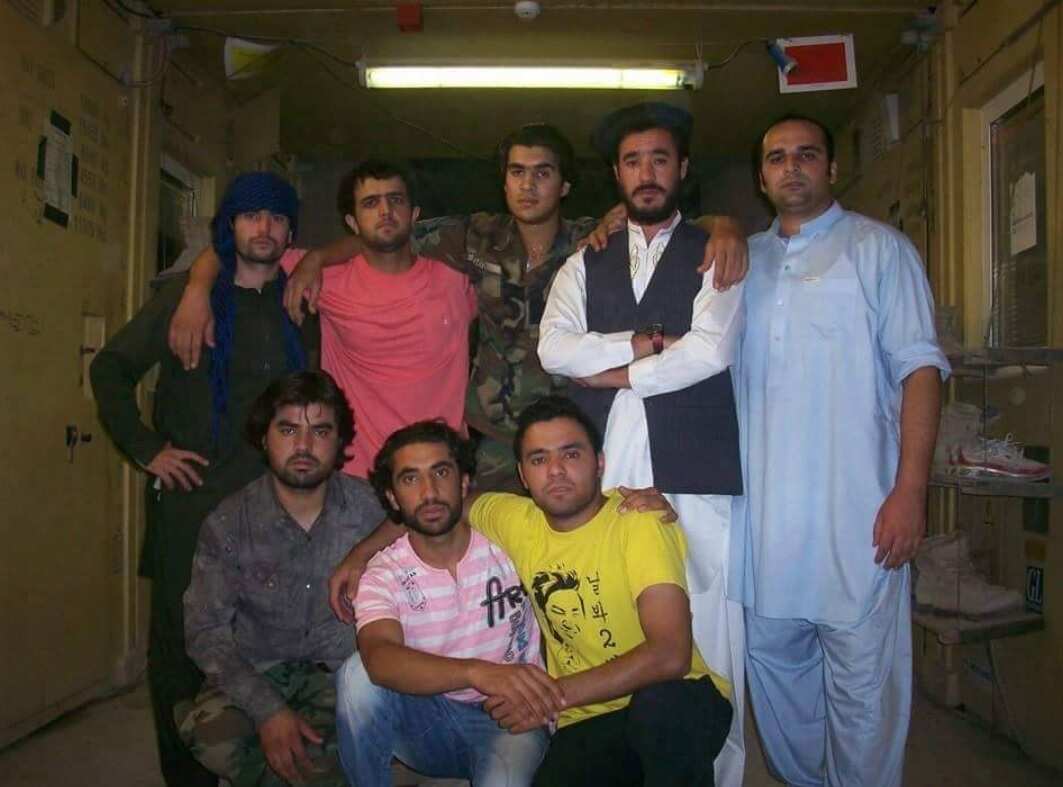 Jawid (centre, with uniform) with fellow interpreters inside the Uruzgan camp.