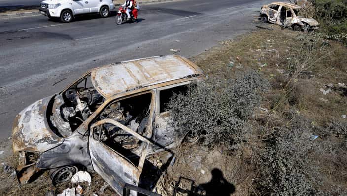 PANIPAT, INDIA - FEBRUARY 23: Damaged Cars on National Highway 1, at Murthal town after Jat protests for reservation in government services turned violent on February 23, 2016 in Panipat, India. Jats are agitating for quotas in jobs and want to be counted