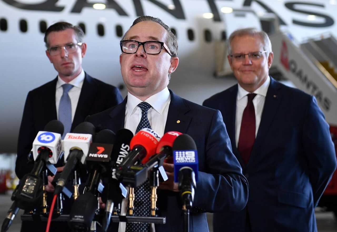Qantas Group CEO Alan Joyce (centre) with Prime Minister Scott Morrison (right) and NSW Premier Dominic Perrottet (left).