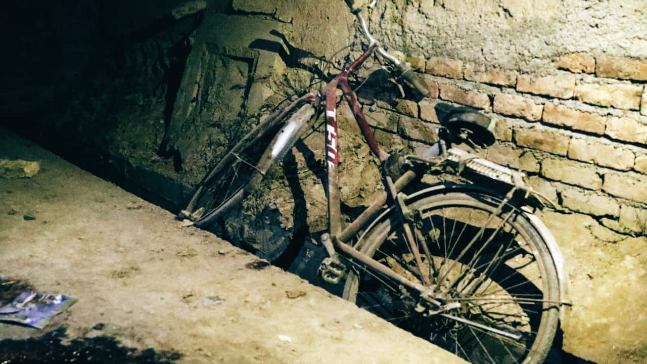 Bloodstained bike of a student is seen on the ground at the scene of a suicide attack that targeted an 'Kawsar-e Danish' educational centre in Kabul.