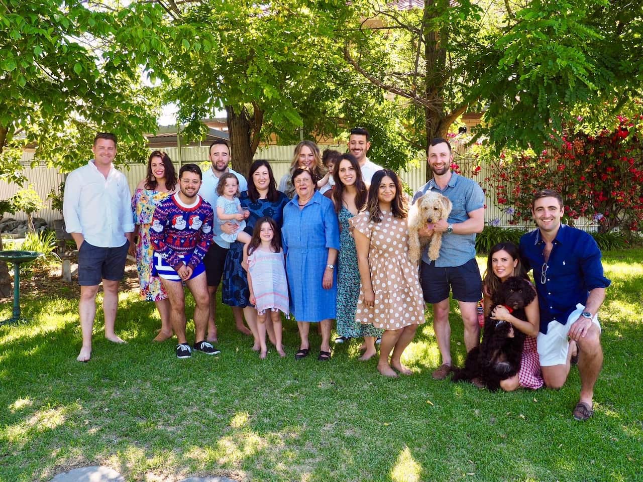 Family photo of Despina Kapiris surrounded by her grandchildren