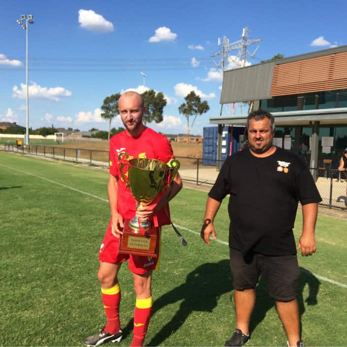 Captain of Broadmadow Megic with the winner's cup