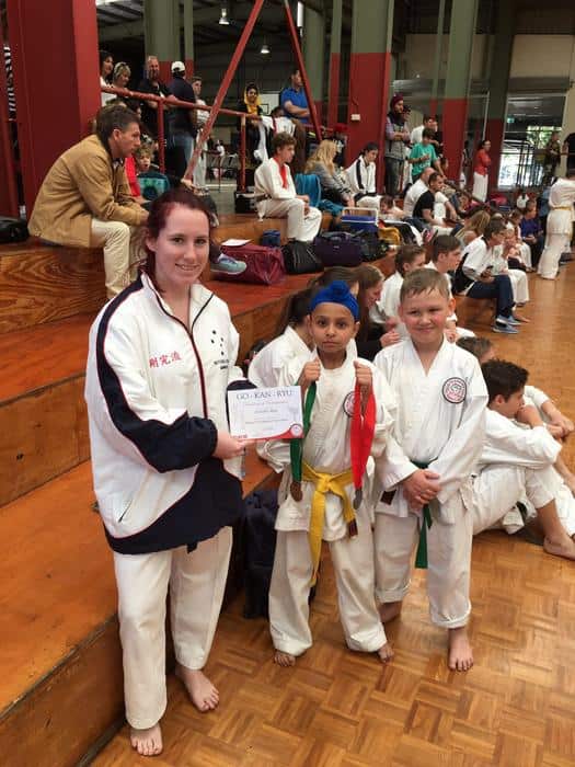 Amitojbir with his medals at a karate competition