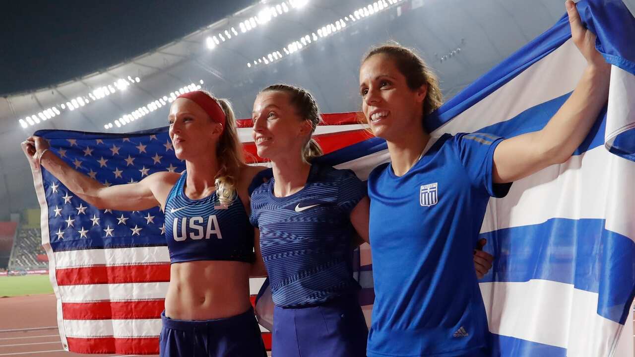 Anzhelika Sidorova (C) of Russia, Sandi Morris (L) and Katerina Stefanidi celebrate after the women's Pole Vault final in Doha