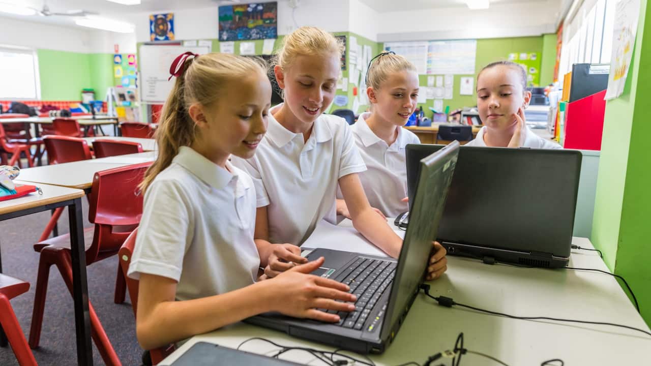 Students learning during computer class