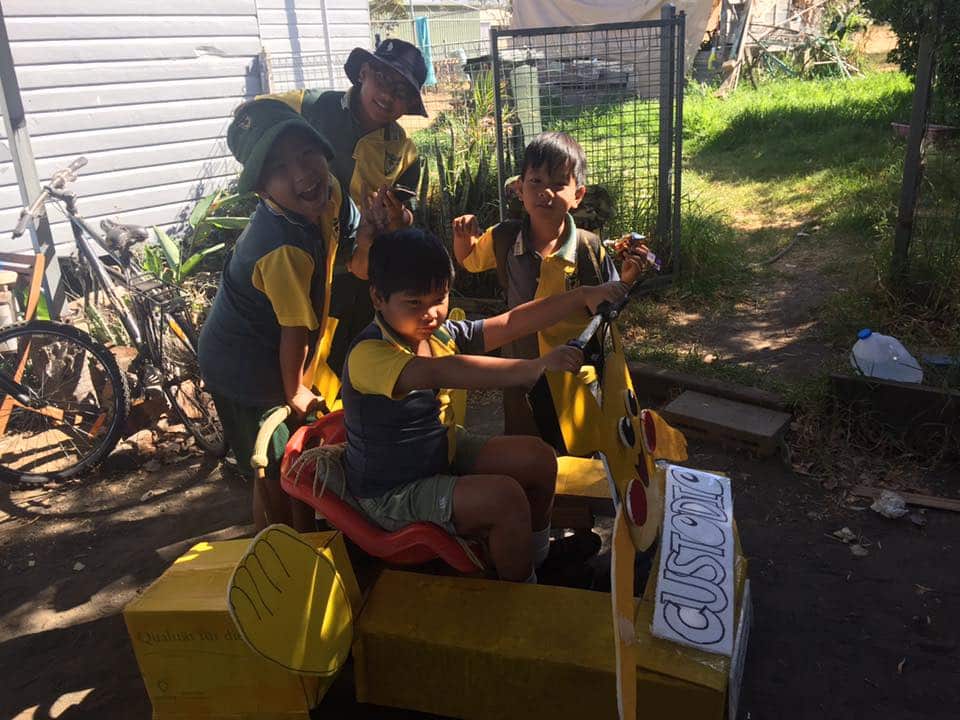 Custodio kids on their way to a cart competition at school