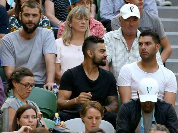 Virat Kohli and Yuvraj Singh at Australian Open tennis Mens' semi final between Roger Federer and Novak Djokovic