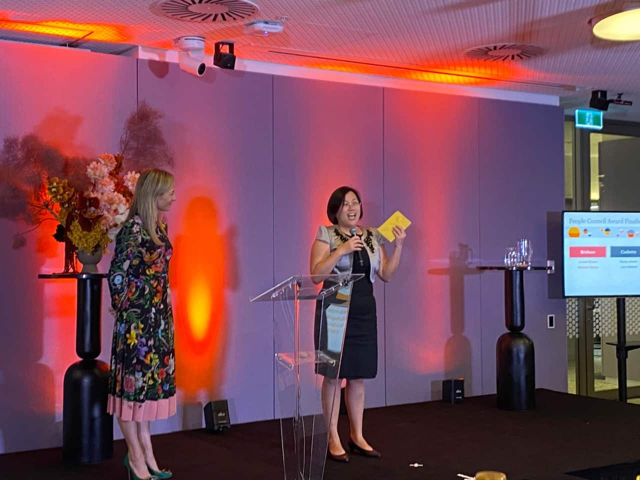 Suet Koon Lai receiving a company award for outstanding service and achievement. 