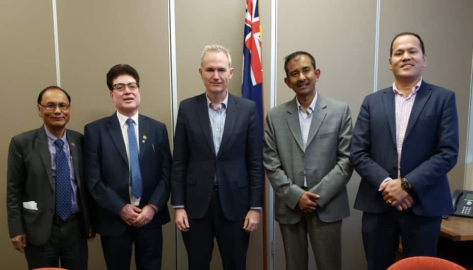 Dr Krishna Hamal (left) from FeNCAA and other Nepali community representatives with David Coleman (centre).