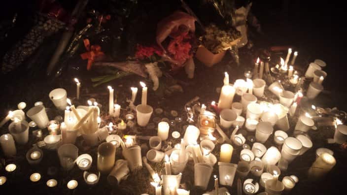 Candles are seen in tribute to Prabha Arun Kumar