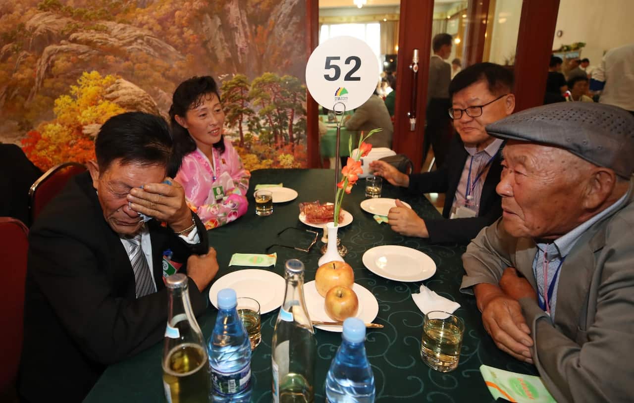 Father-son reunited after 65 years 91-year-old Lee Gi-soon (R) looks at his son Lee Gang-seon at a banquet at Kumgang Mountain Hotel in North Korea