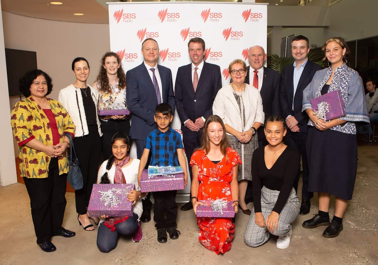 The competition winners with the judges, SBS managing director James Taylor and Education Minister Dan Tehan.
