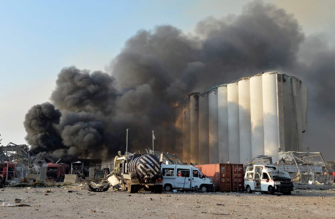 Smoke billows from harbor area with damage and debris after a large explosion rocked the harbour of Beirut, Lebanon.