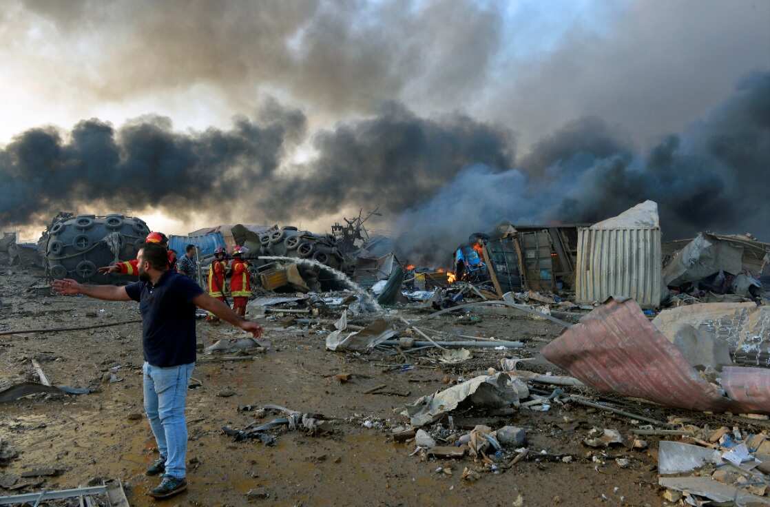 Lebanese firefighters work at the scene of explosion at the Beirut Port, Beirut, Lebanon, 04 August 2020.