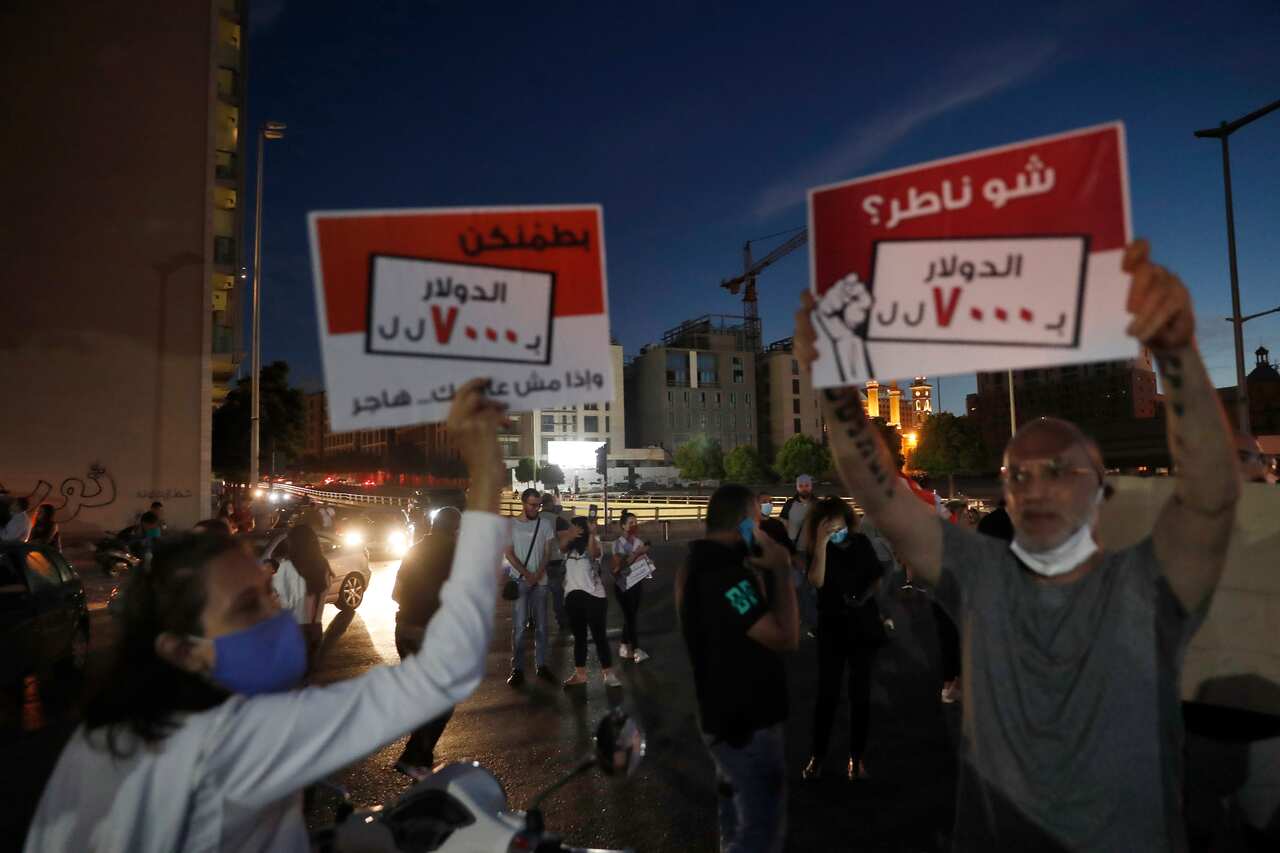 Anti-government protesters in front of the government house in downtown Beirut, Lebanon, Thursday, June 11, 2020. 