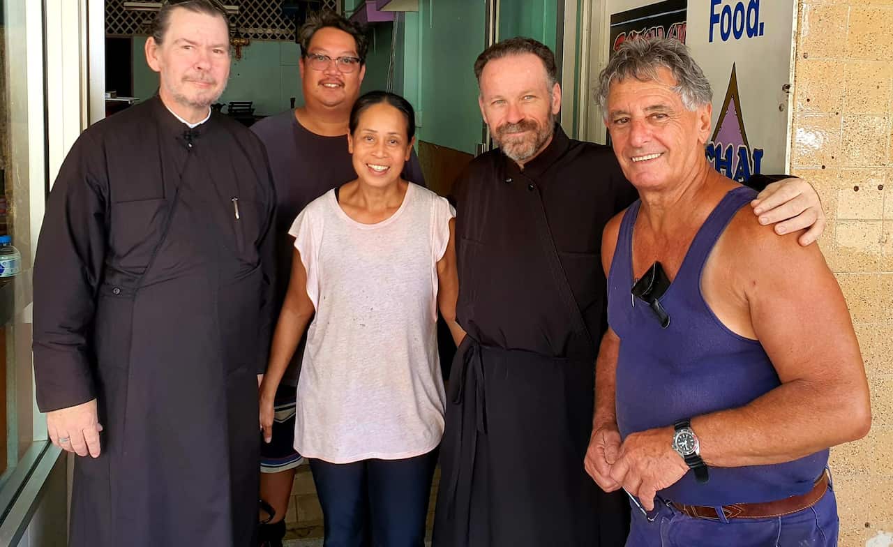 Fr Dimitri Tsakas and Fr Roman with Lismore locals