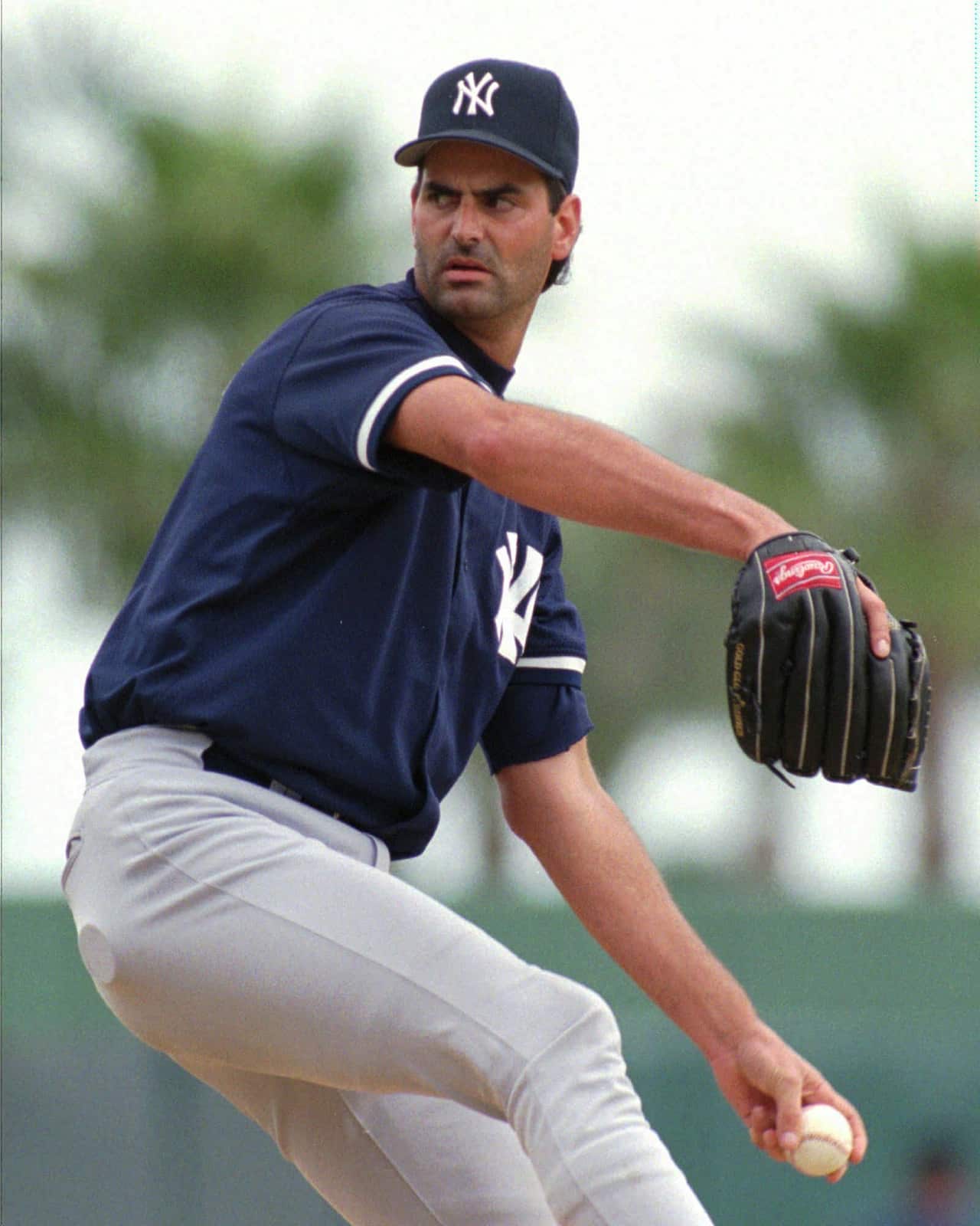 File: New York Yankees relief pitcher Graeme Lloyd from Australia pitches during the Yankees game against the St. Louis Cardinals in 1997.