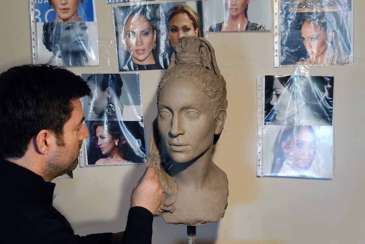 Artist working on sculpture 