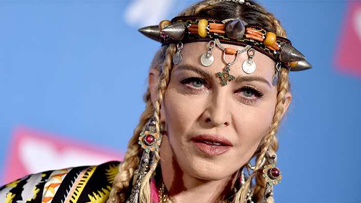 Madonna poses in a press conference.
