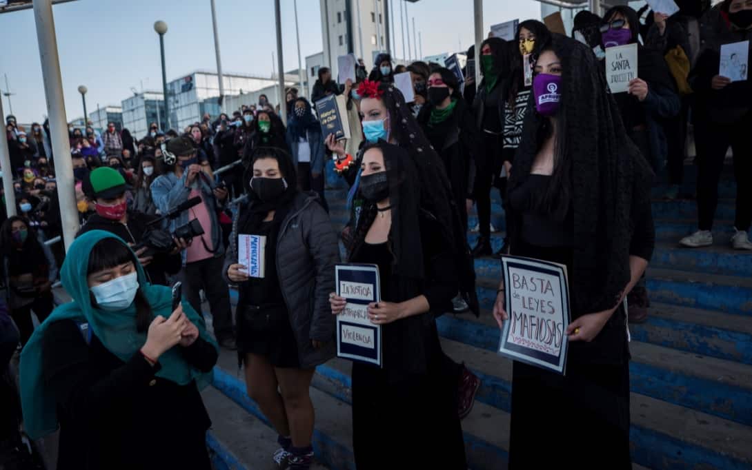 People attend a protest performance called by the Las Tesis group to ask for a new and egalitarian Constitution, in Valparaiso.