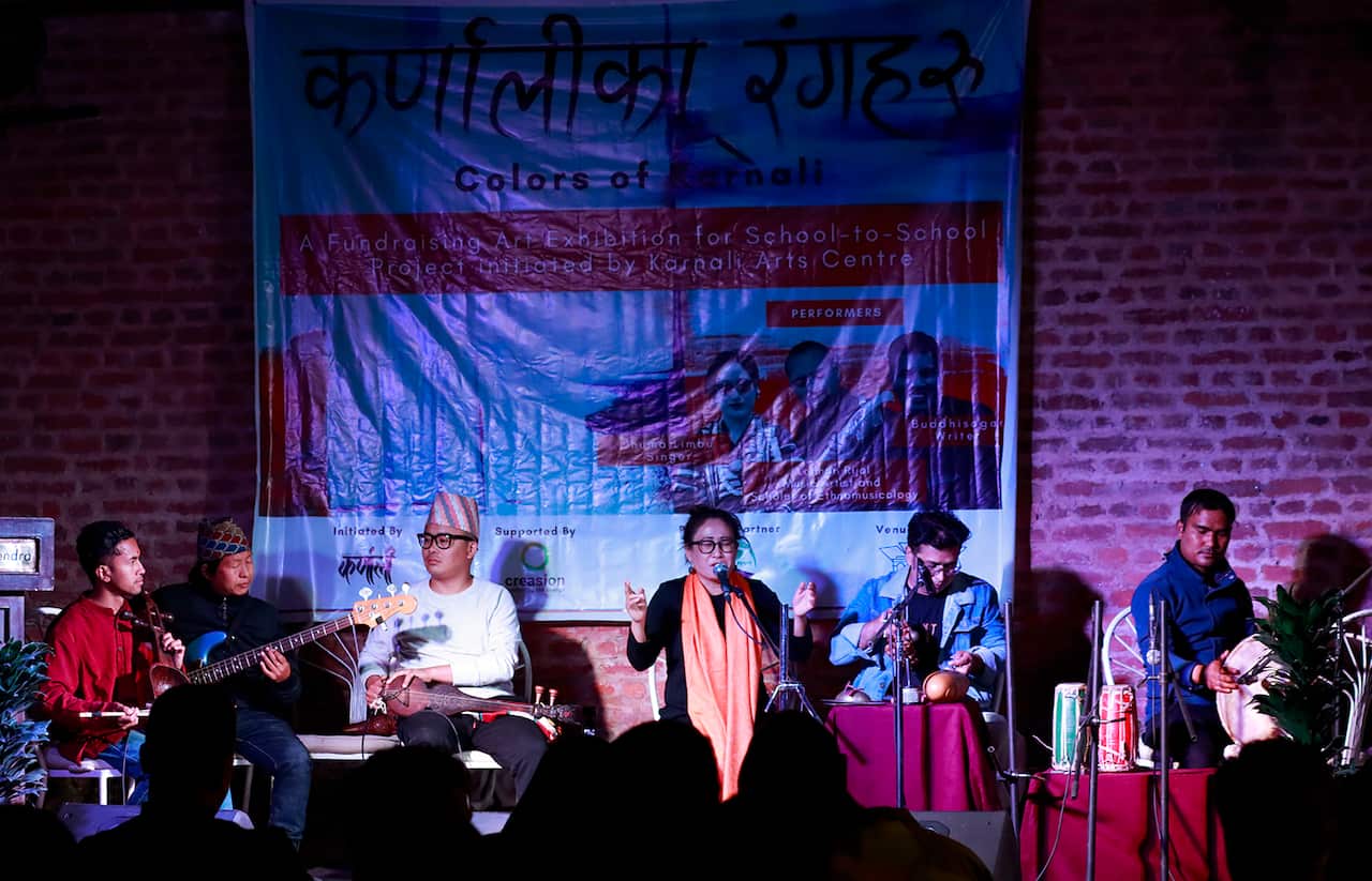 Artists playing music in a painting display program in kathmandu.