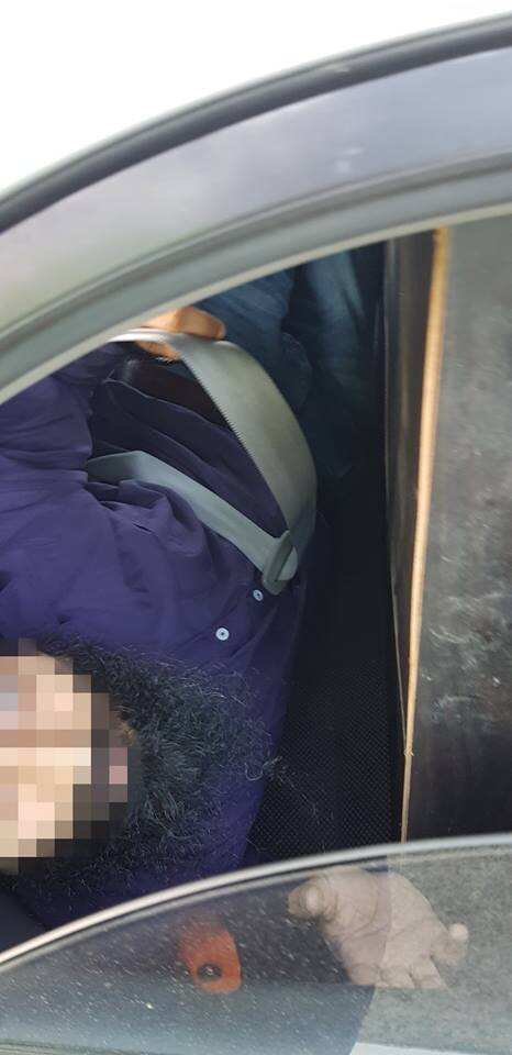 men in rear seat with cabinet