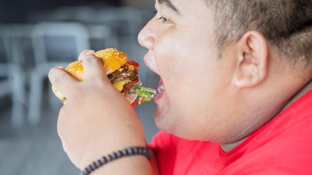 man eating a burger