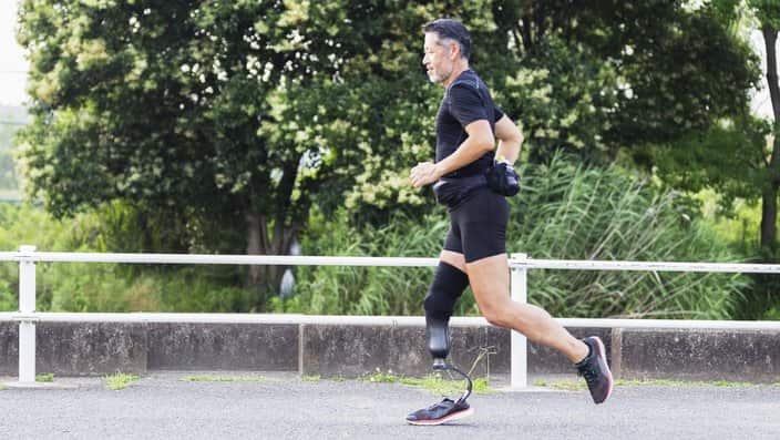 A man with a disability jogs