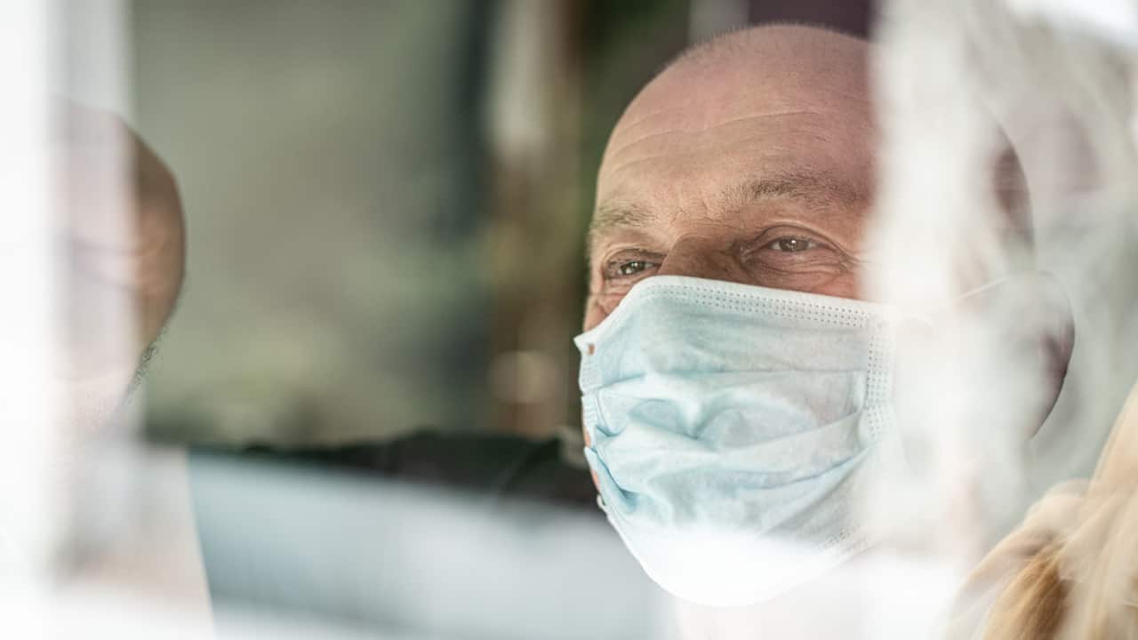 Man looking out the window 