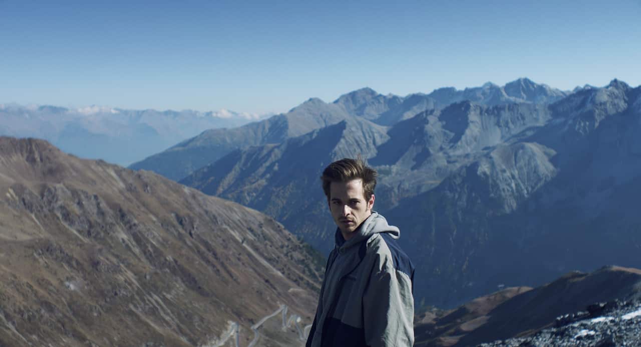 Victor in mountain scene