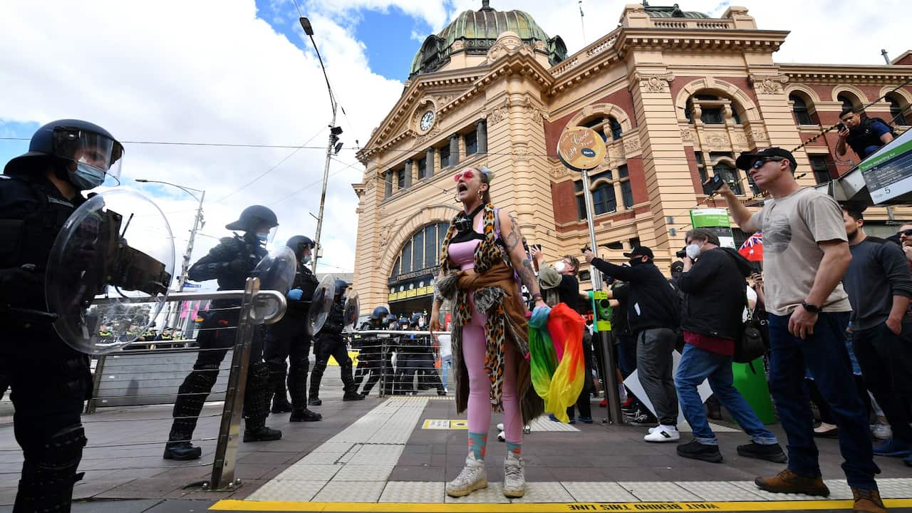 Protesters gather for a 'National Rally for Peace, Freedom and Human Rights' anti-lockdown protest in Melbourne, Saturday, August 21, 2021. 