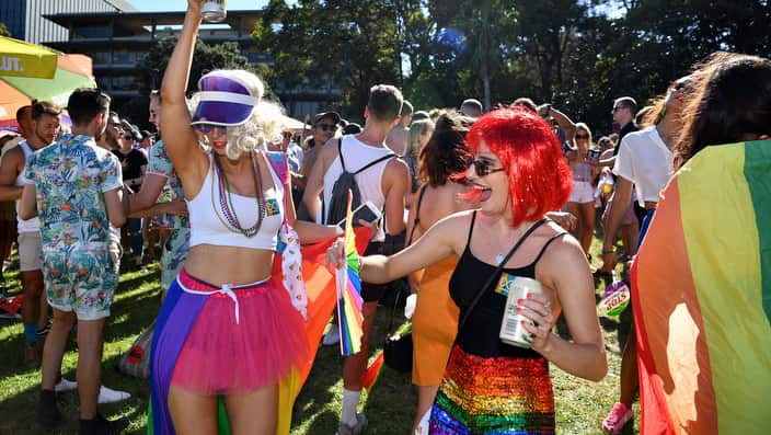 Festival guests dance to music at the Sydney Gay and Lesbian Mardi Gras Fair Day in Sydney, Sunday, February 17, 2019. (AAP Image/Joel Carrett) NO ARCHIVING