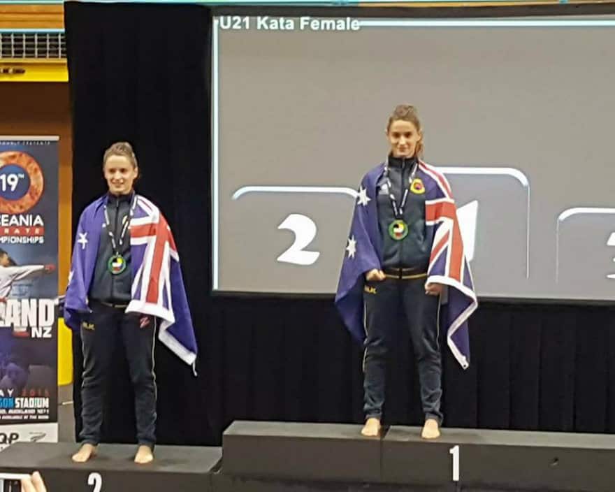 Marijana and Mishela with Australian flag at the medal ceremony