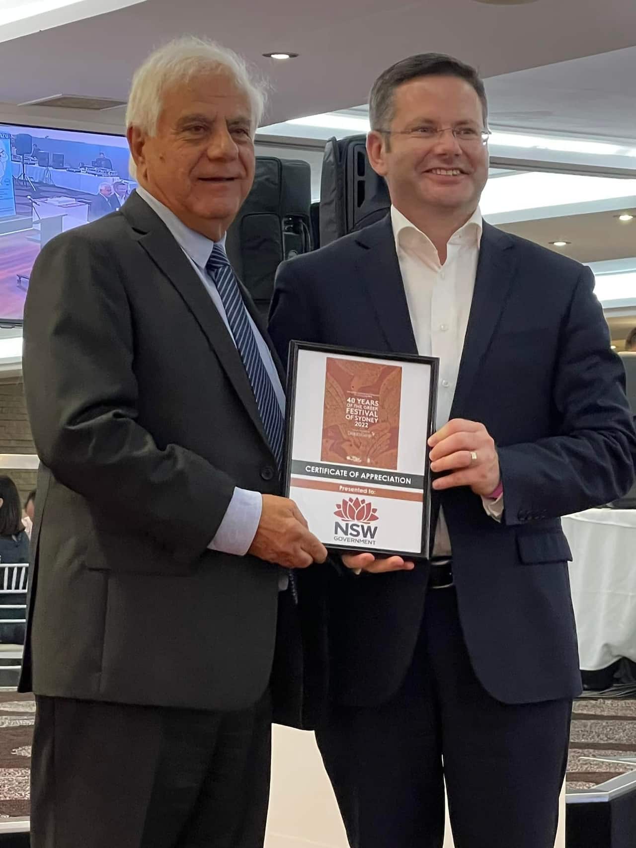  Ο πρόεδρος της Κοινότητας Χάρης Δανάλης με τον υπουργό Πολυπολιτισμικών Υποθέσεων της ΝΝΟ, Mark Coure