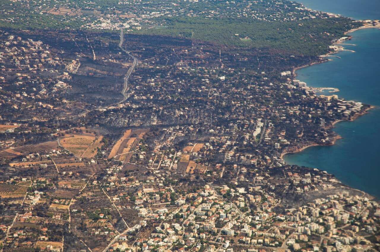 Pictures of burnt Mati and Neos Voutsas from an airplane window after take off, the area is in eastern Attica near Athens after the fire. 