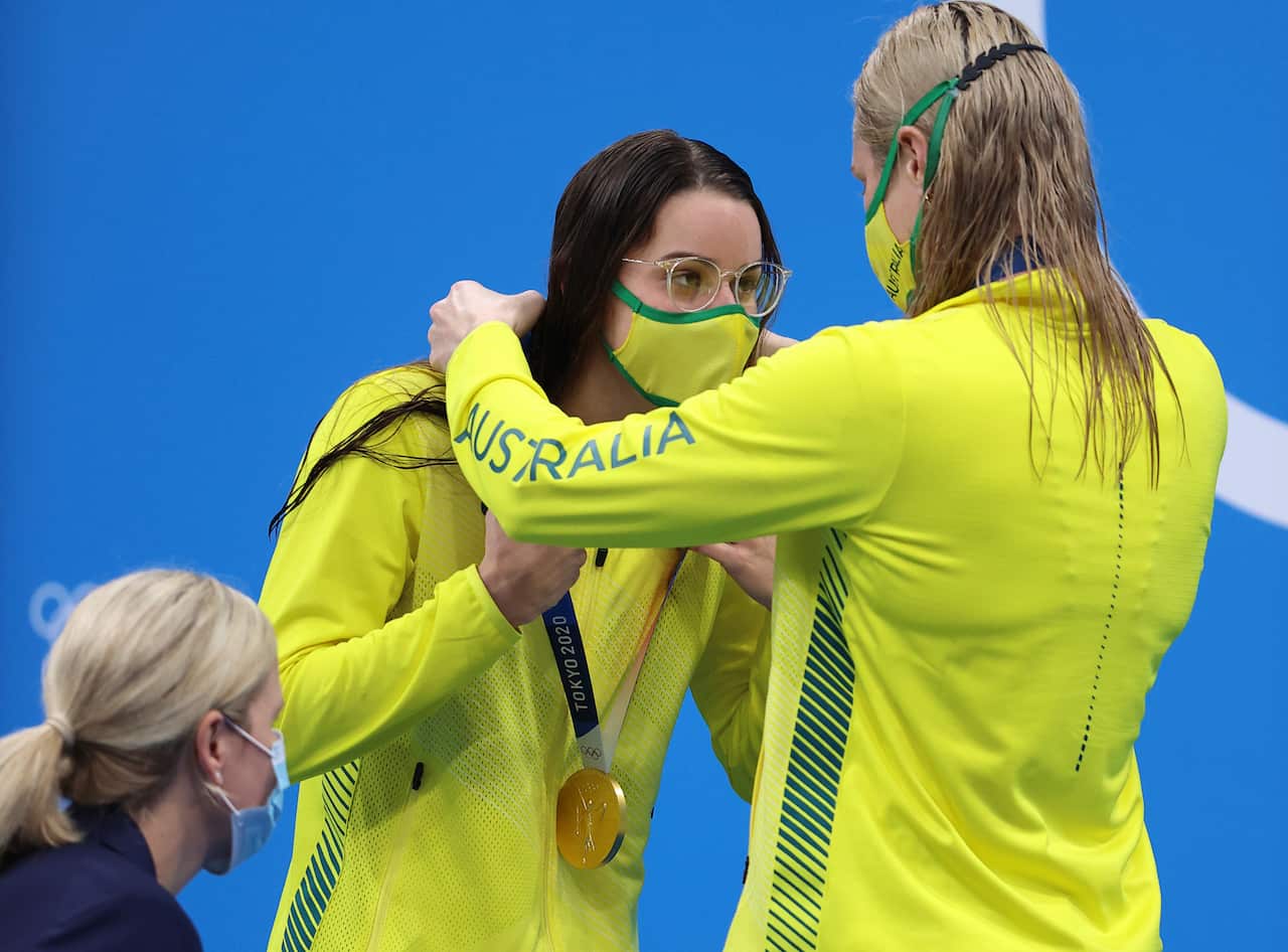 Australia's McKEOWN Kaylee (L) receives the gold medal from her country person SEEBOHM Emily