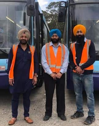 Mehnga Singh Khakh with fellow bus drivers in Sydney