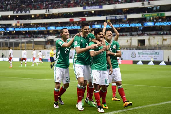 Mexico's Jesus Corona (2-R) celebrates with teammates