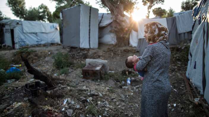 19-year-old Syrian refugee Narmeen Zaytoun from Idlib, holds her 23-day-old son Mohammed in Moria, Lesbos