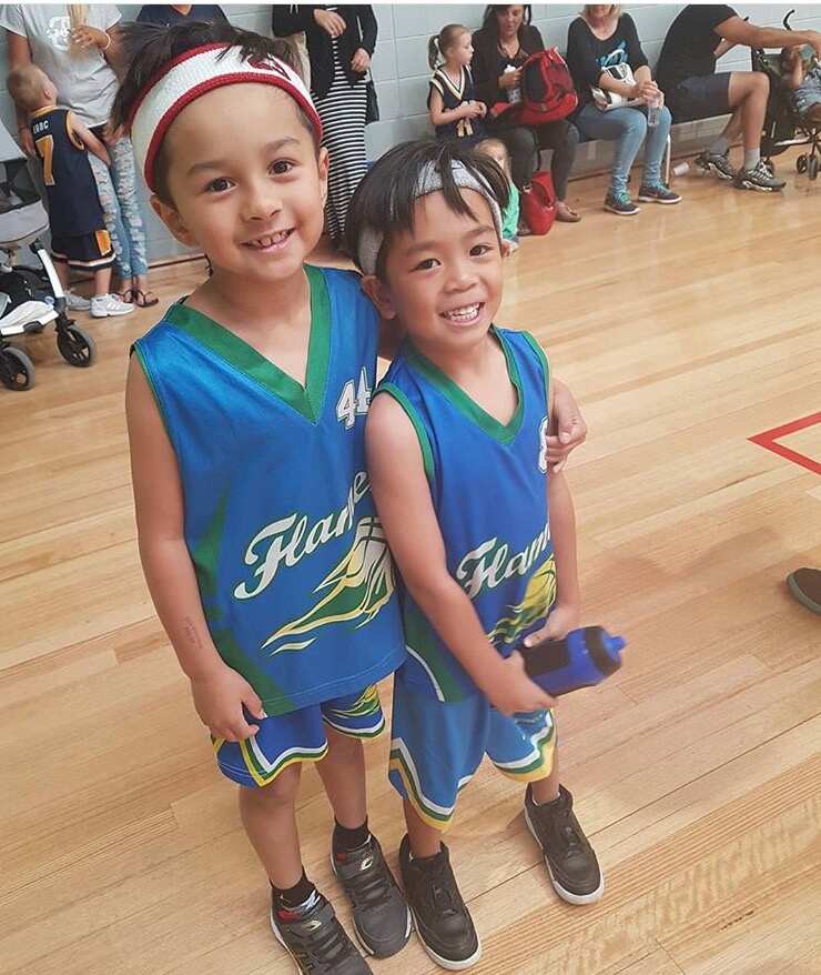 Son Michael Castelo with fellow basketball player