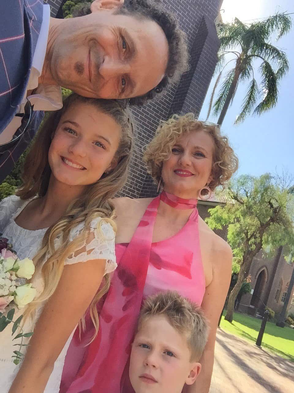 Michela, con un vestito "Carla Zampatti", e Roberto assieme ai figli.