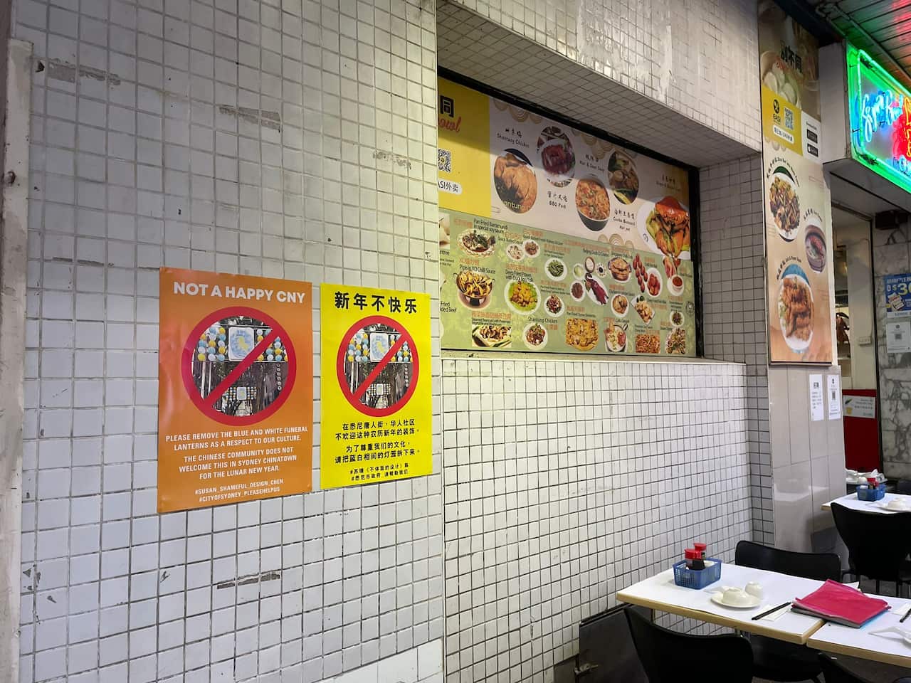 "Not a happy CNY" posters in Sydney's Chinatown