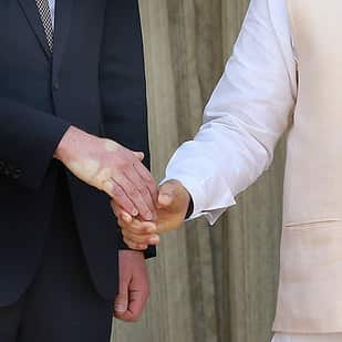 A strong handshake  by Indian prime minister Nanrendra Modi (C) leave a impression at the Britain's Prince William's hand prior to a meeting  at Hyderabad House in New Delhi, India 12 April 2016. Prince William and his wife Catherine are on a visit to Ind