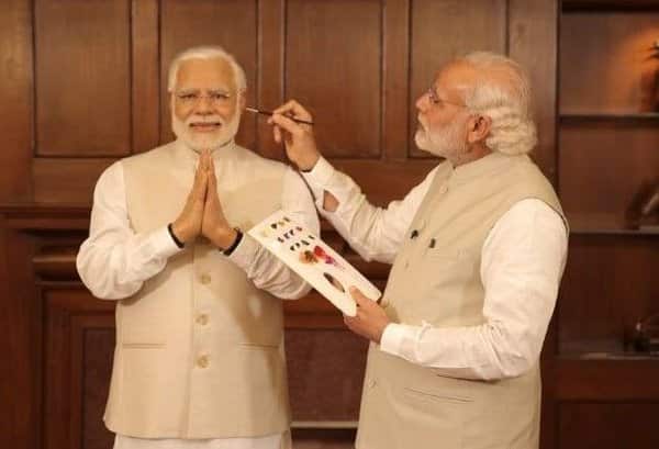 India's PM Narendra Modi giving finishing touches to one of his Madame Tussaud's wax models