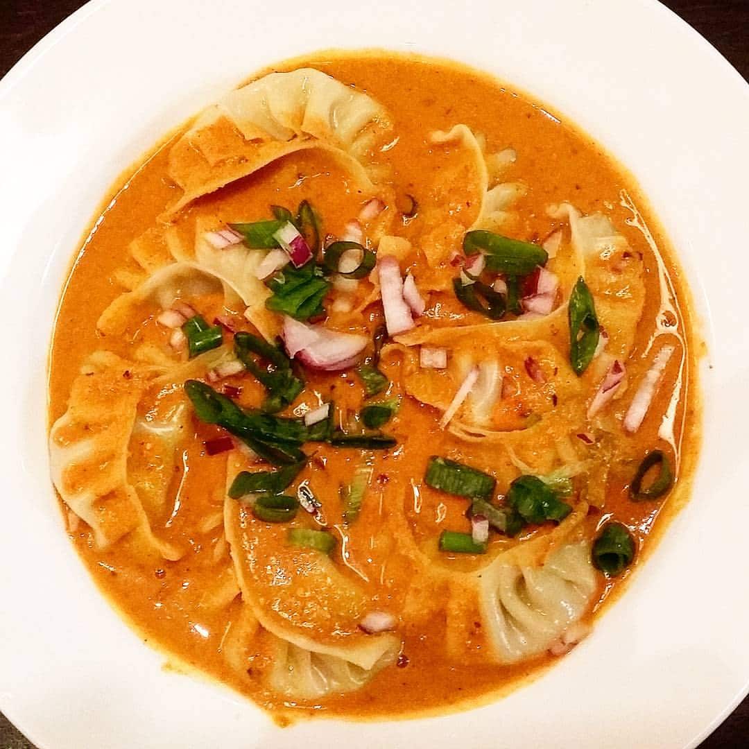 Momo served in a hot spicy soup