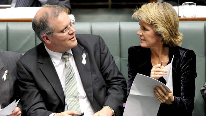 Deputy opposition leader Julie Bishop speaks with Shadow immigration minister Scott Morrison during House of Representatives question time at Parliament House Canberra, Monday, Oct. 25, 2010. (AAP Image/Alan Porritt) NO ARCHIVING