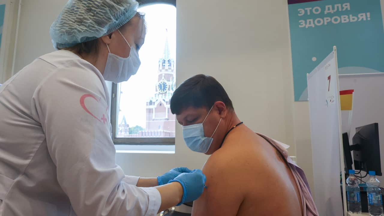 MOSCOW, RUSSIA - OCTOBER 5, 2021: A man receives an injection at a COVID-19 vaccination centre set up at the GUM department store, its daily capacity increased to 5,000 citizens. Furthermore, there are a hundred vaccination centres based on Moscow polycli
