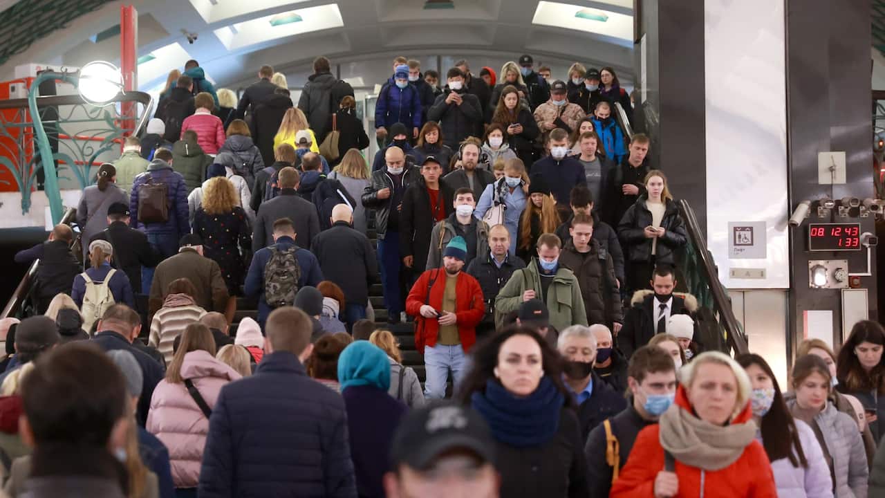 MOSCOW, RUSSIA - OCTOBER 4, 2021: People are seen at the Slavyansky Bulvar station of the Moscow Metro during the morning rush hour. 