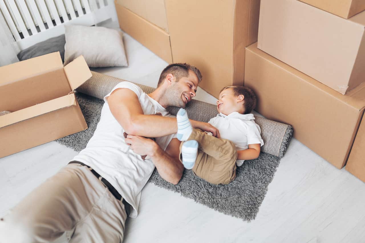 Moving concept, Father and his son moving into their new home